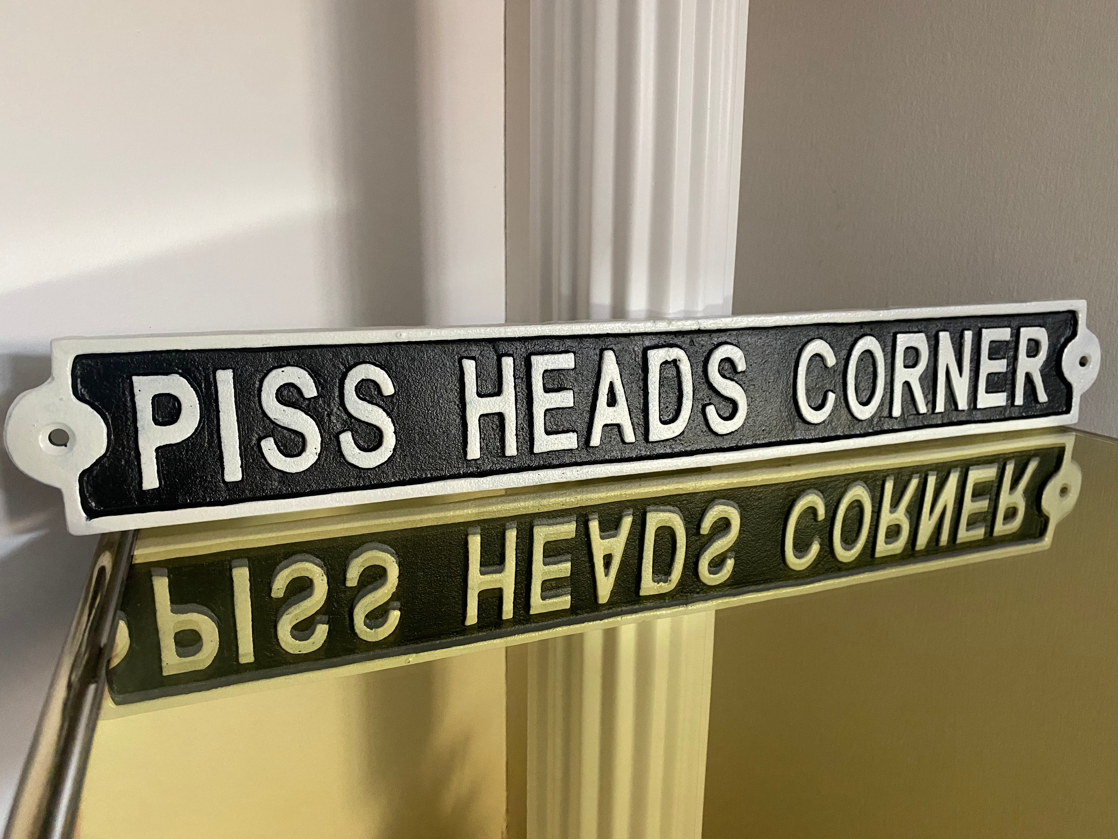 Piss Heads Corner Sign