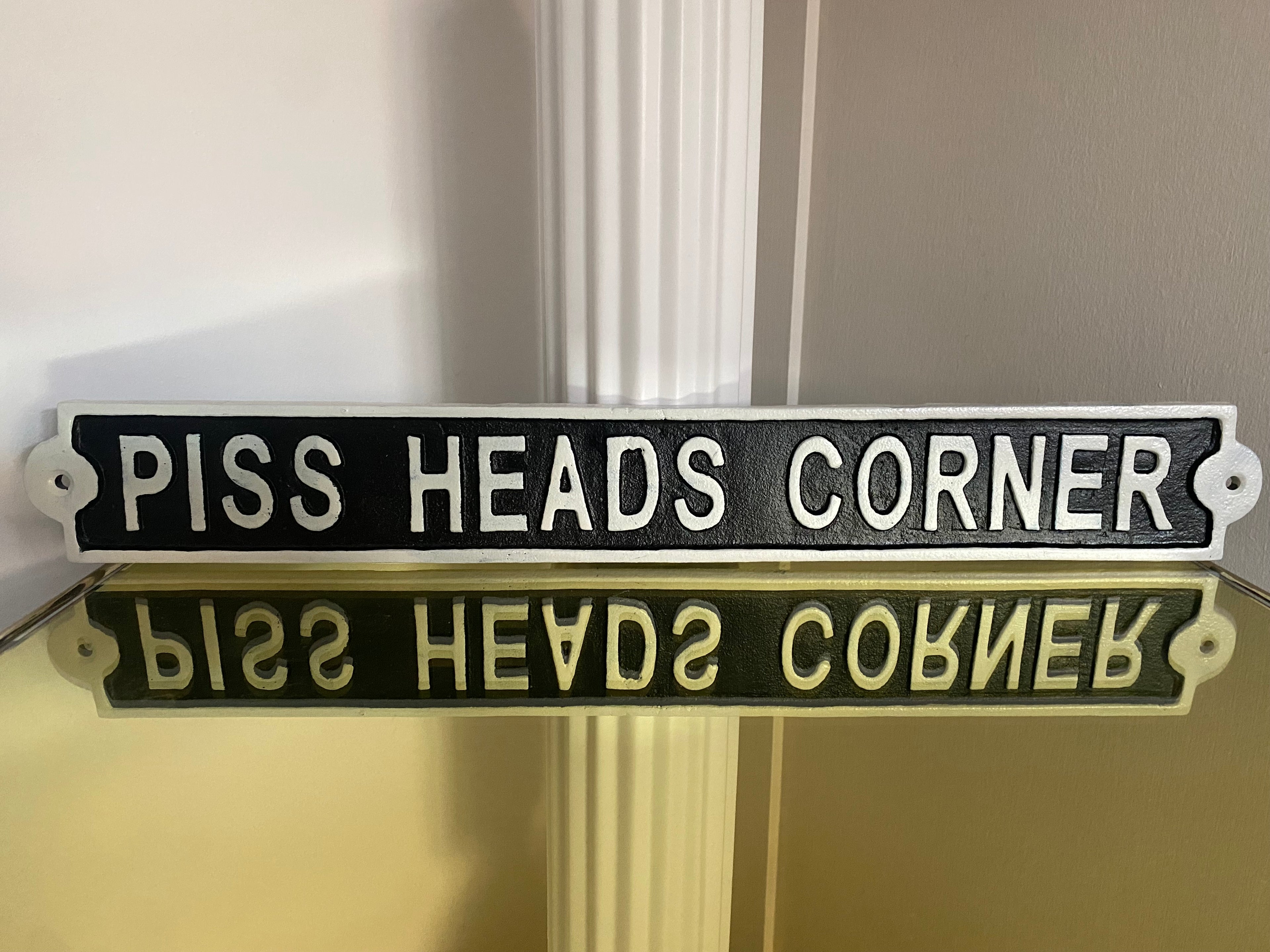 Piss Heads Corner Sign