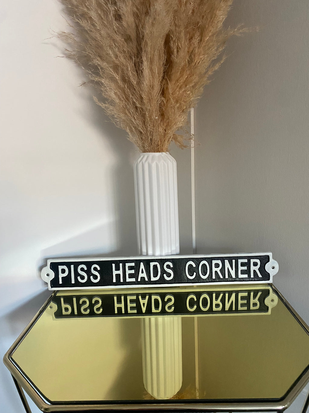 Piss Heads Corner Sign
