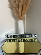 Piss Heads Corner Sign